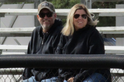 David & Melissa Caywood sitting in the Grandstands